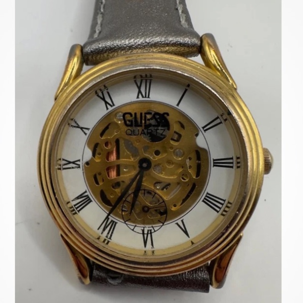 Guess Gold and Silver Quartz skeleton watch